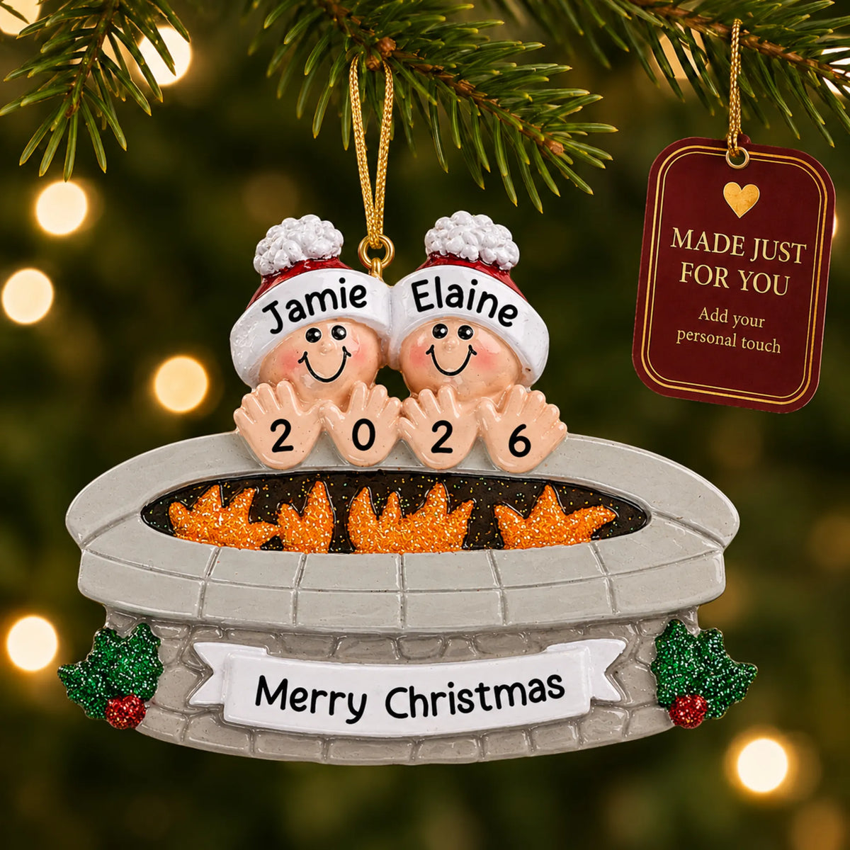 Fire pit couple christmas ornament hanging on a lit Christmas tree with a Made Just For You gift tag