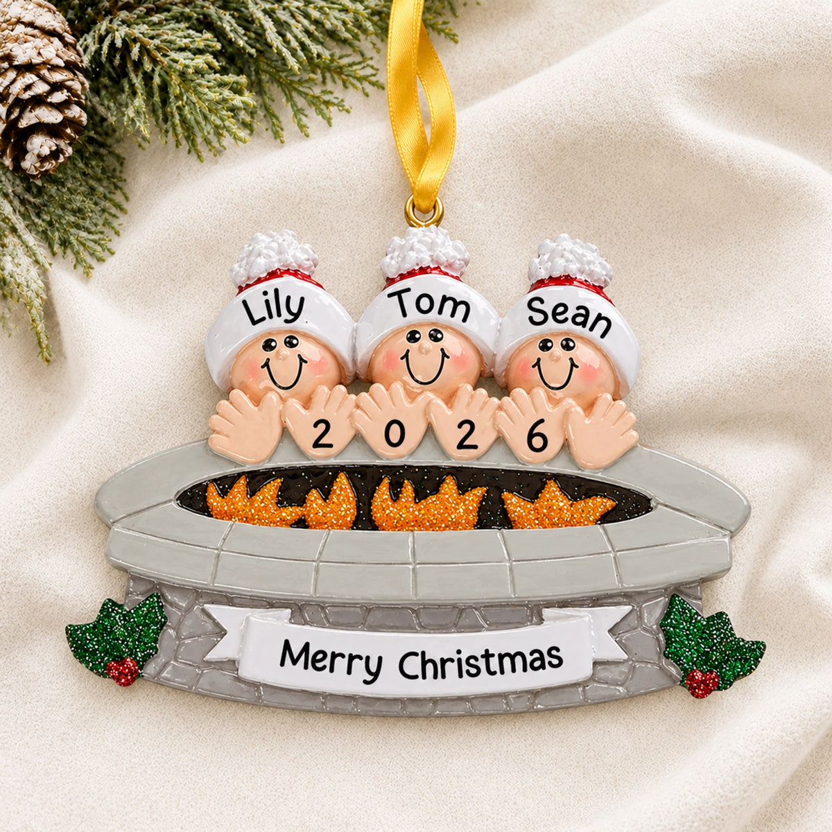 Personalized fire pit family of 3 christmas ornament on a soft knit blanket with three names and the year