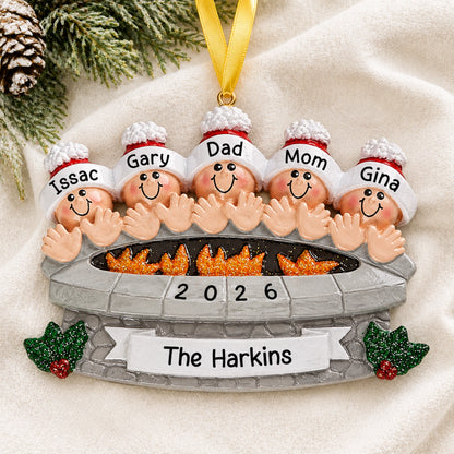 Personalized fire pit family of 5 christmas ornament with names hanging on a snowy white background