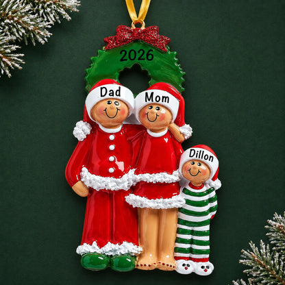 Personalized ethnic family of 3 christmas ornament on a dark green pine background