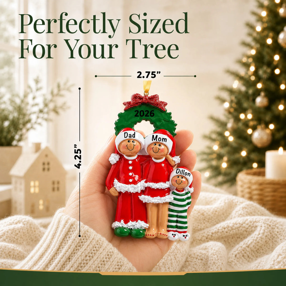 Size guide: the personalized ethnic family of 3 christmas ornament is 4.25 in wide by 2.75 in tall, shown in hand