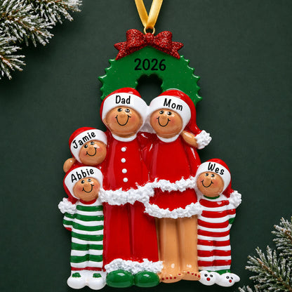 Personalized ethnic family of 5 christmas ornament on a dark green pine background