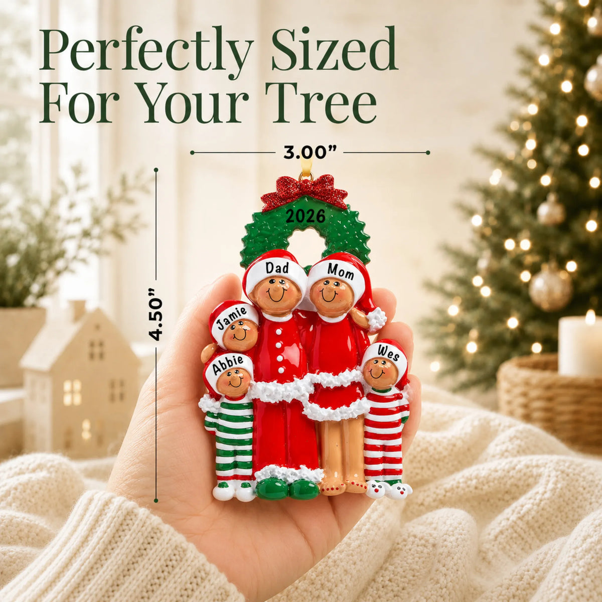 Size guide: the personalized ethnic family of 5 christmas ornament is 4.25 in wide by 3.00 in tall, shown in hand
