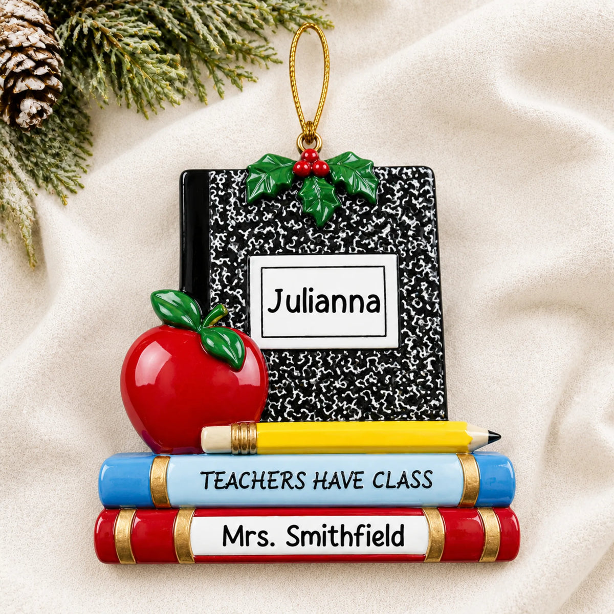 Personalized Teachers Have Class Christmas ornament shown on a soft white blanket