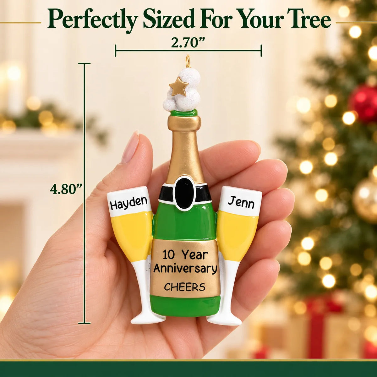 Personalized champagne anniversary Christmas ornament held in hand, about 2.7 inches wide by 4.8 inches tall