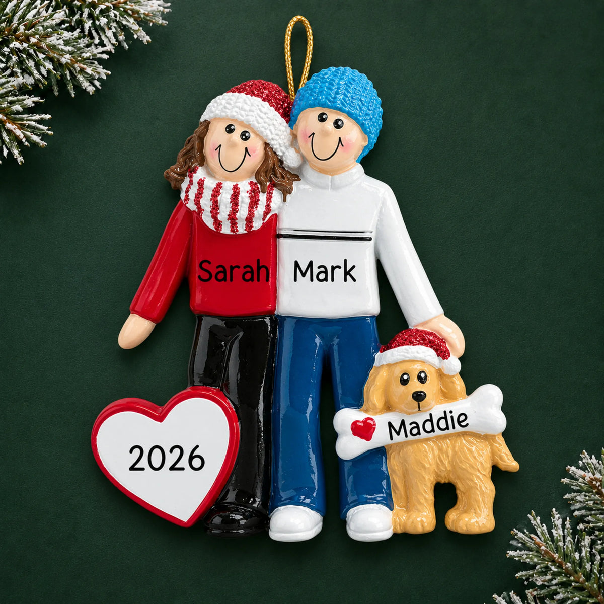 Personalized winter couple with dog christmas ornament on a dark green pine background