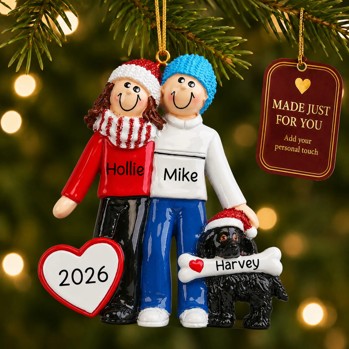 Winter couple with black dog christmas ornament hanging on a lit Christmas tree with a Made Just For You gift tag