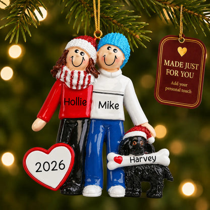Winter couple with black dog christmas ornament hanging on a lit Christmas tree with a Made Just For You gift tag
