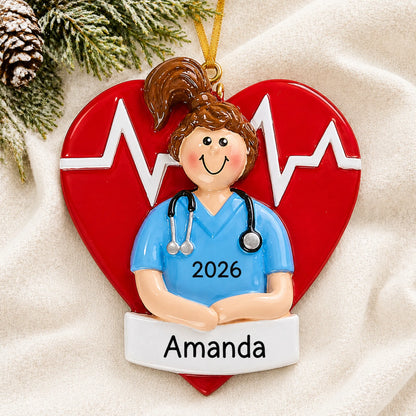 Personalized nurse red heart christmas ornament laid on a soft white knit blanket