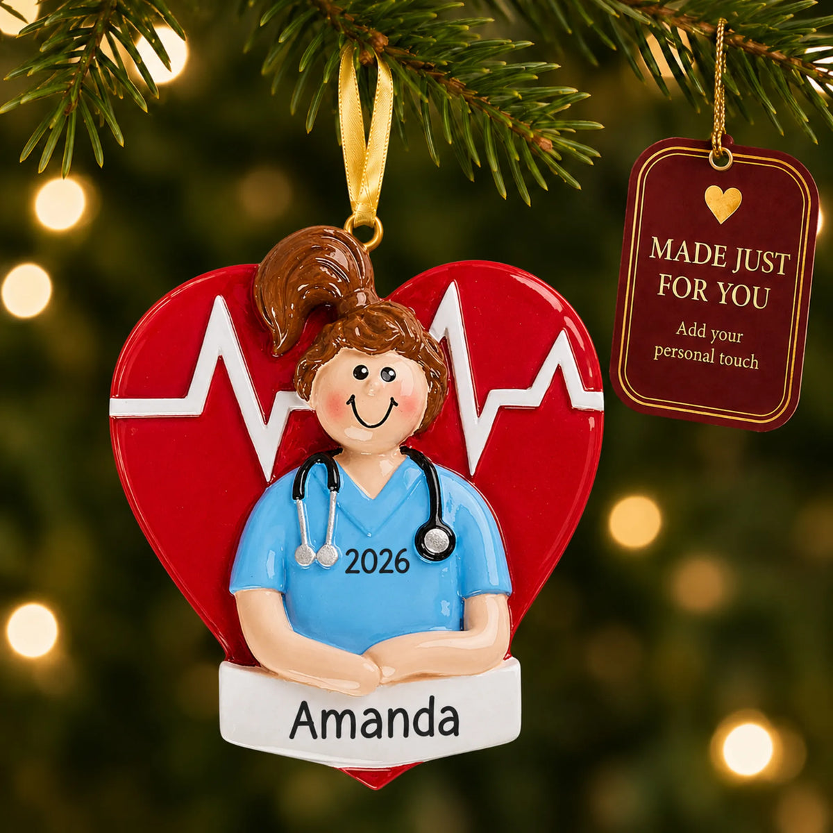 Nurse red heart christmas ornament hanging on a lit Christmas tree with a Made Just For You gift tag