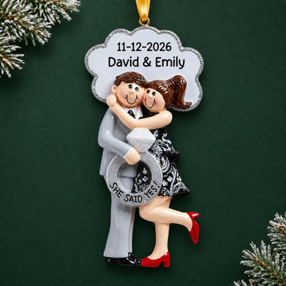 Personalized She Said Yes brunette couple Christmas ornament with a hugging brunette engaged couple, ring, names and date