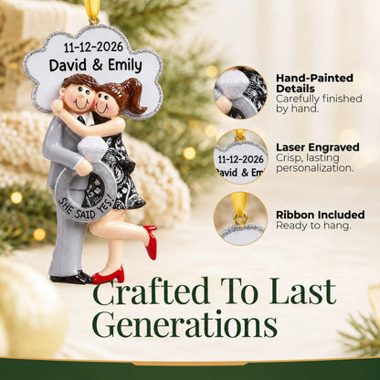 Close-up of the personalized She Said Yes brunette couple Christmas ornament: hand-painted detail, laser engraving
