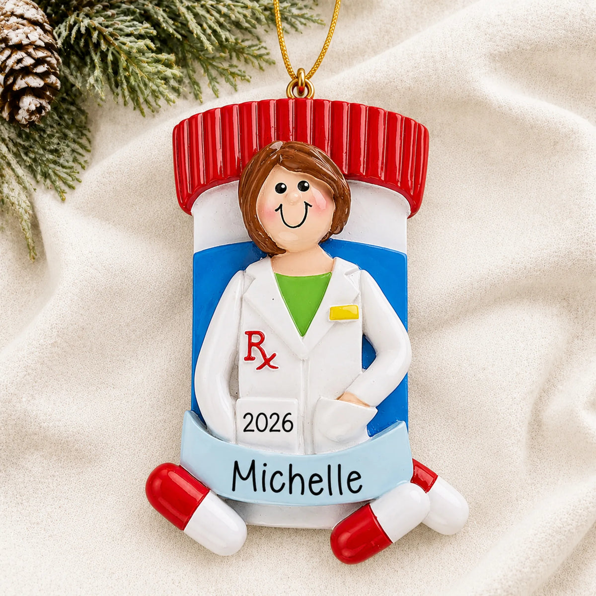 Personalized pharmacist woman christmas ornament laid on a soft white knit blanket