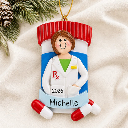 Personalized pharmacist woman christmas ornament laid on a soft white knit blanket