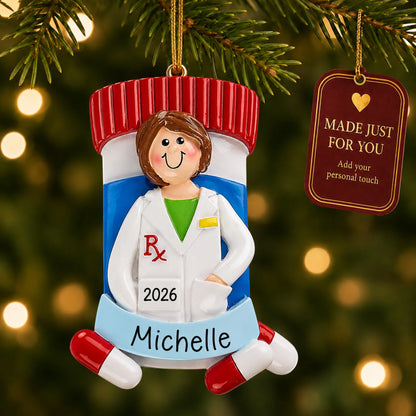 Pharmacist woman christmas ornament hanging on a lit Christmas tree with a Made Just For You gift tag