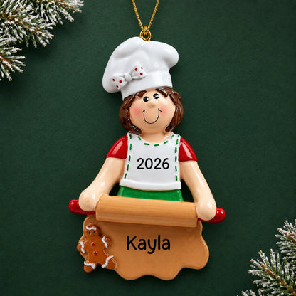 Personalized baking christmas ornament on a dark green pine background