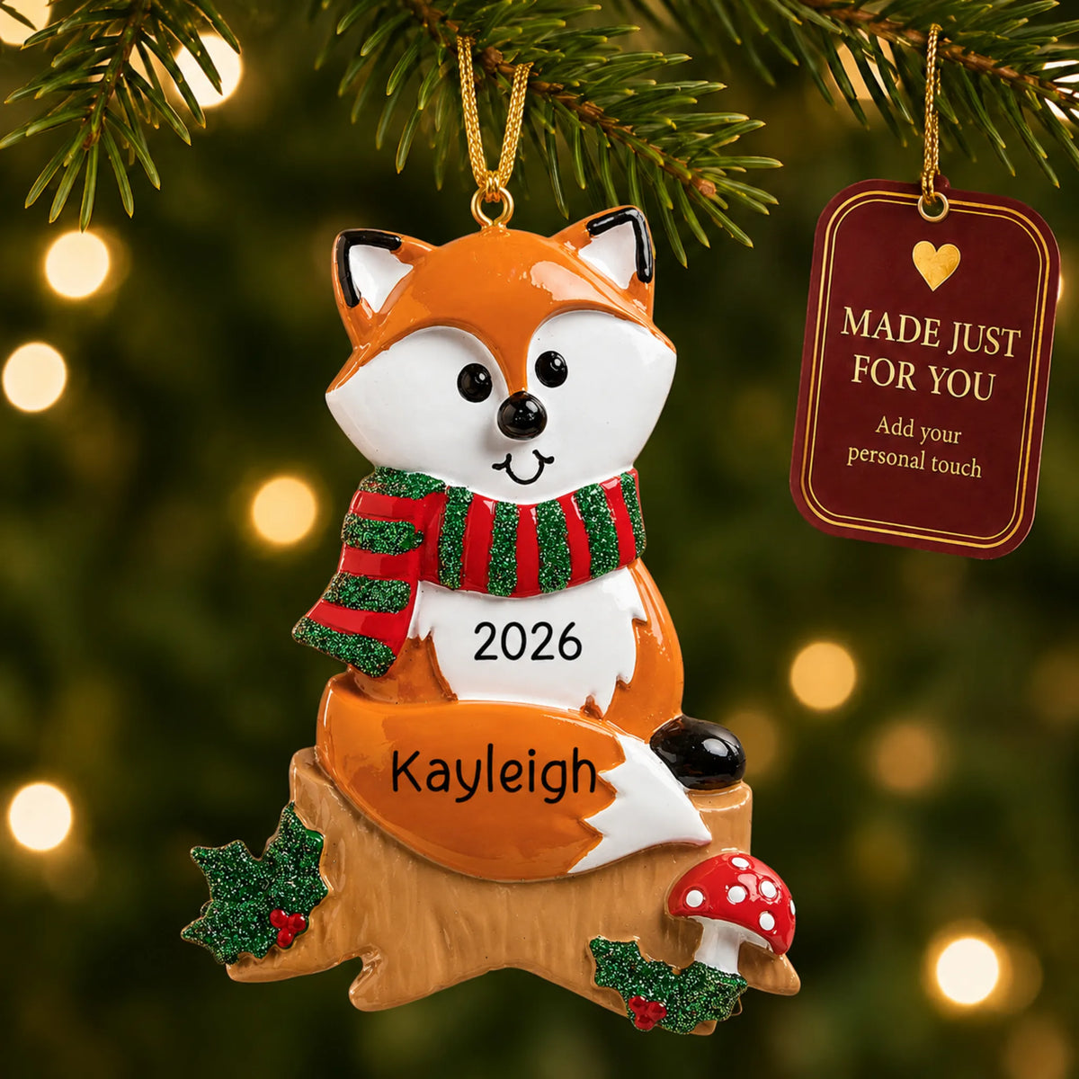 Fox christmas ornament hanging on a lit Christmas tree with a Made Just For You gift tag