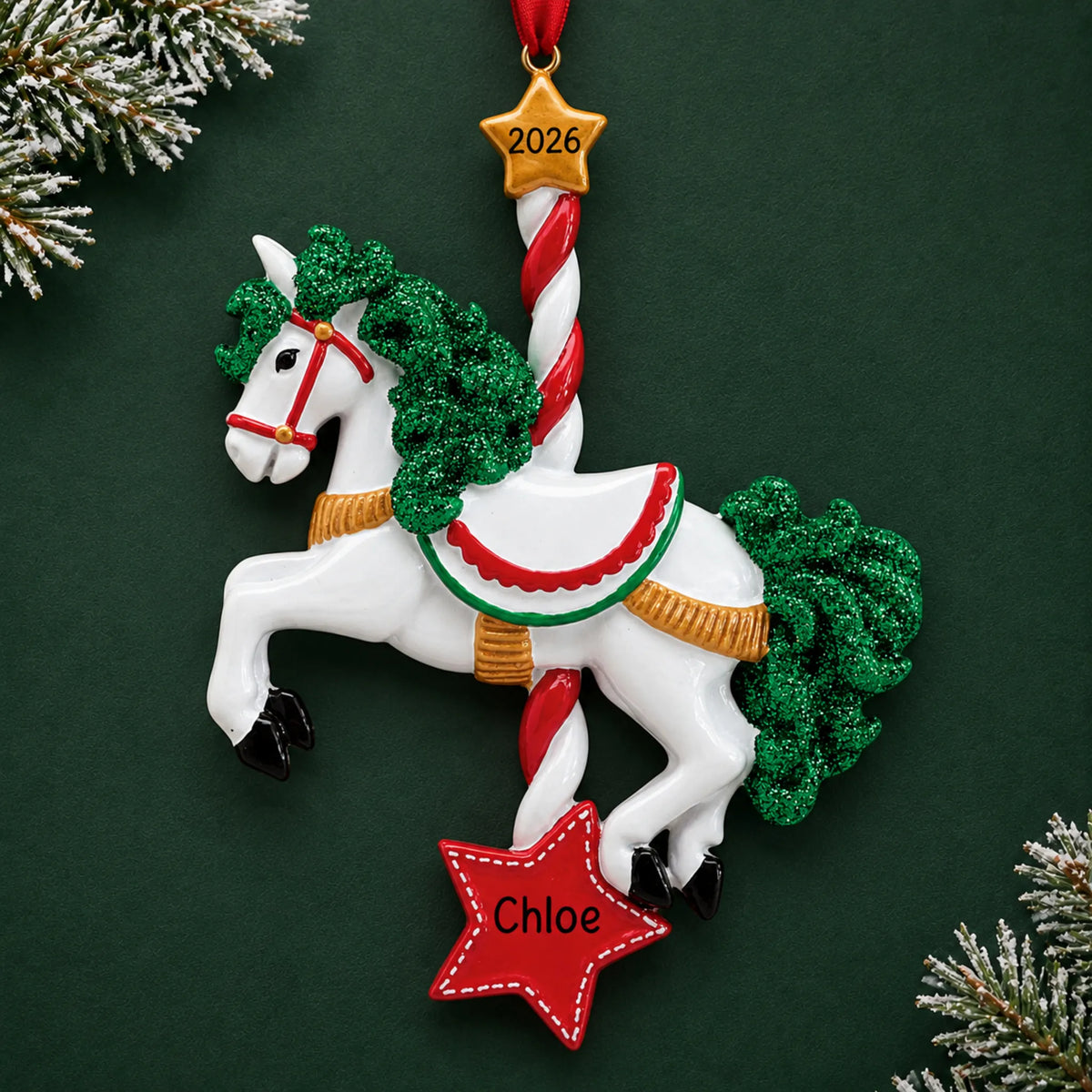 Personalized carousel horse christmas ornament on a dark green pine background