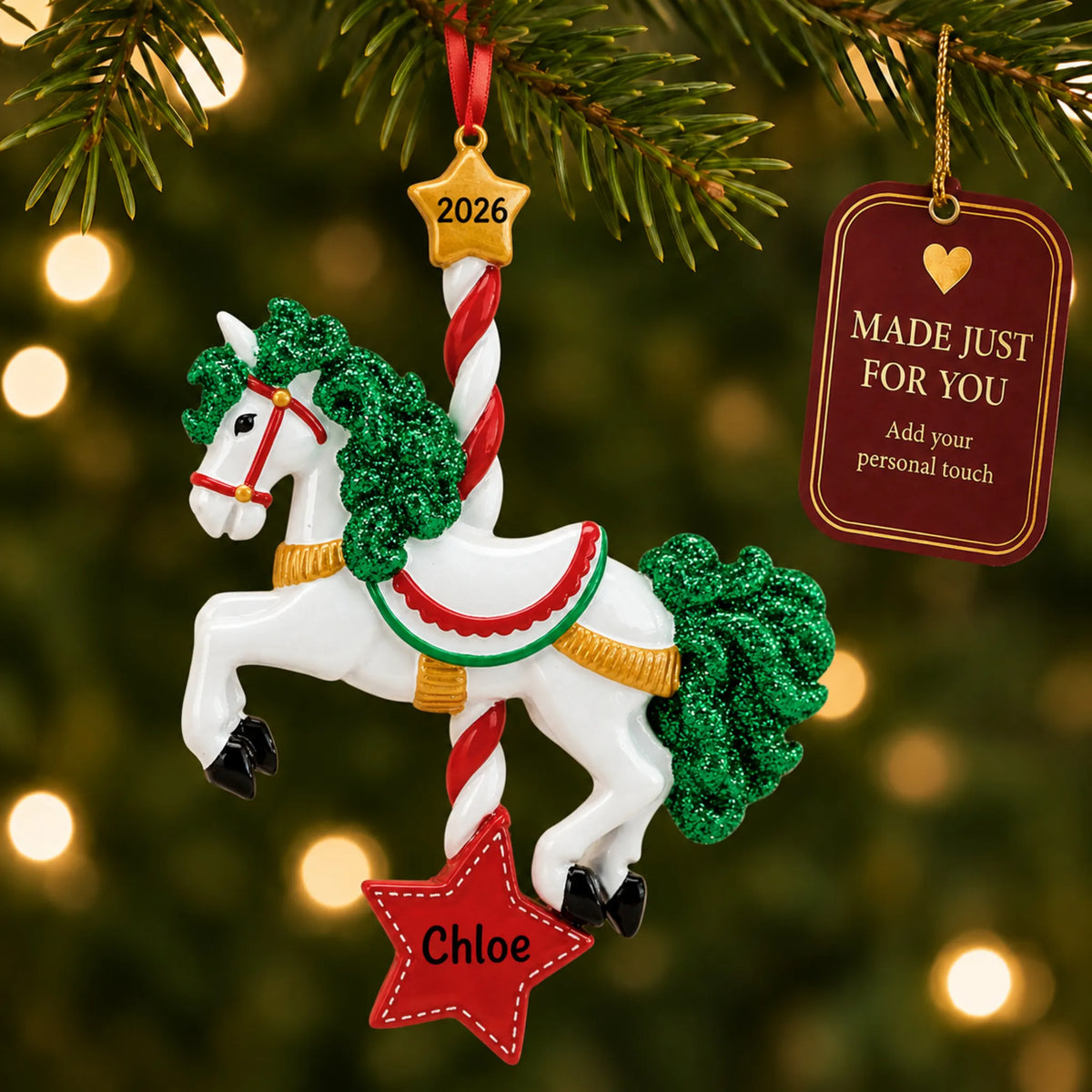 Carousel horse christmas ornament hanging on a lit Christmas tree with a Made Just For You gift tag