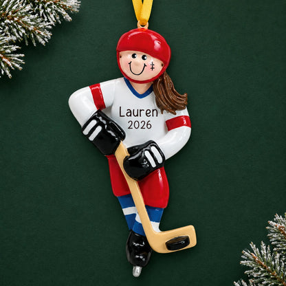Personalized ice hockey girl christmas ornament on a dark green pine background