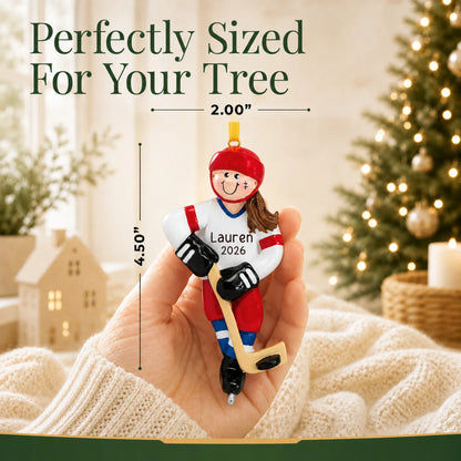 Size guide: the personalized ice hockey girl christmas ornament is 2.00 in wide by 4.50 in tall, shown in hand