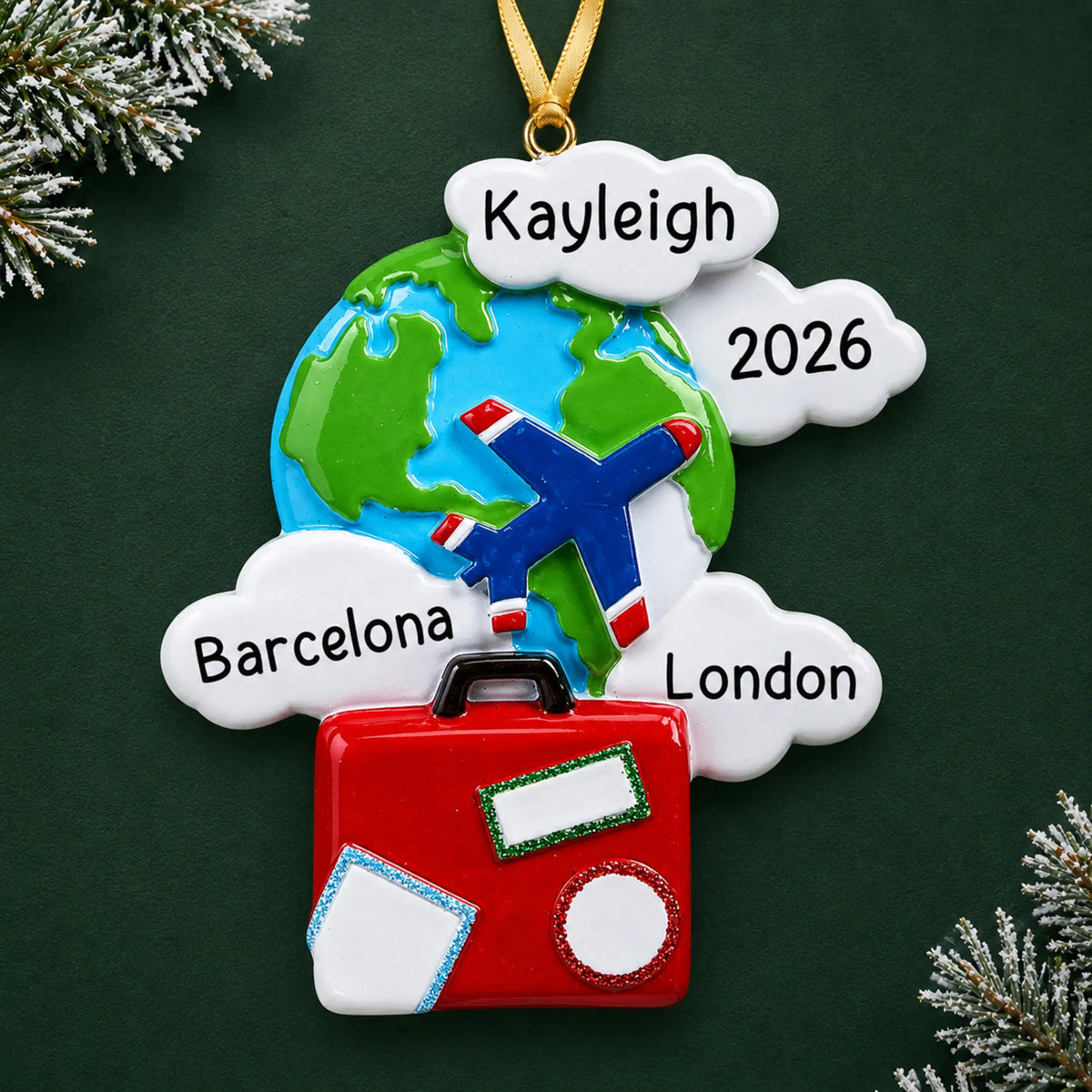 Personalized world traveler christmas ornament on a dark green pine background