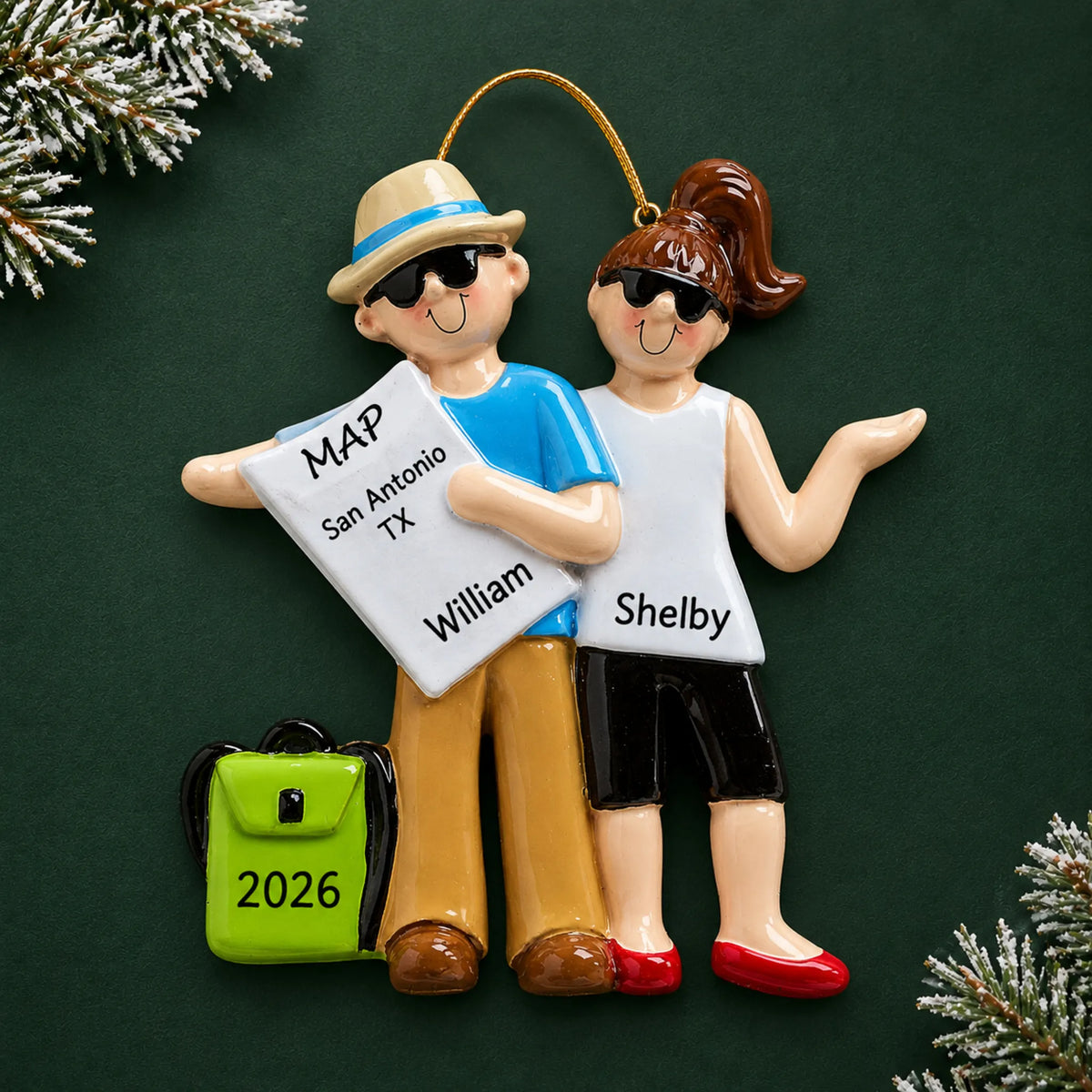 Personalized travel couple christmas ornament on a dark green pine background