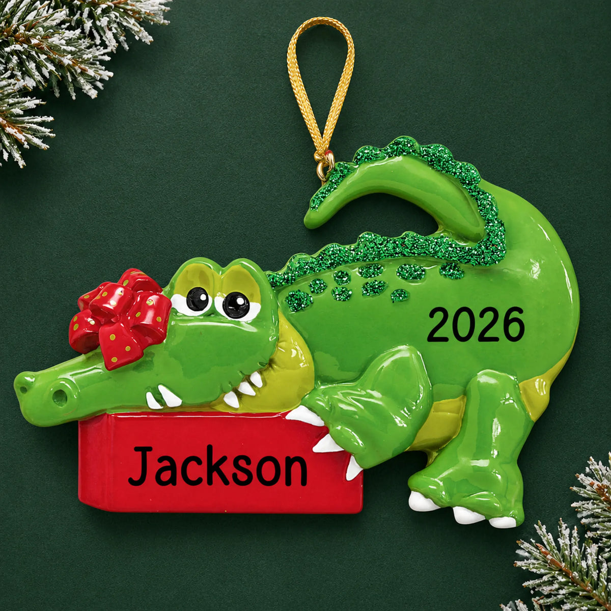 Personalized alligator christmas ornament on a dark green pine background
