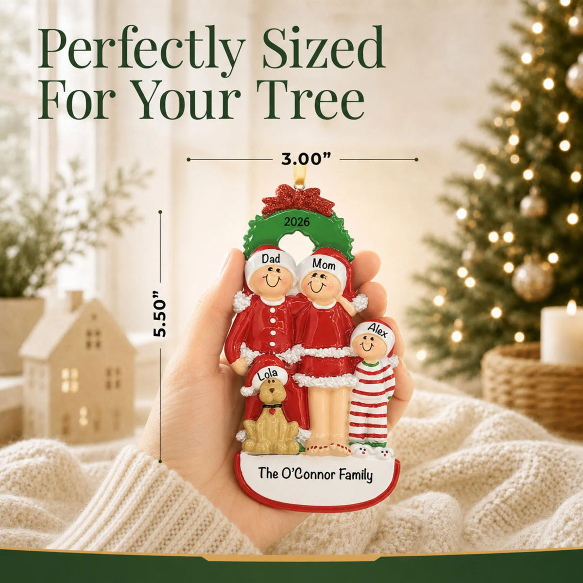 Size guide: the personalized family of 3 with dog christmas ornament is 3.00 in wide by 5.50 in tall, shown in hand