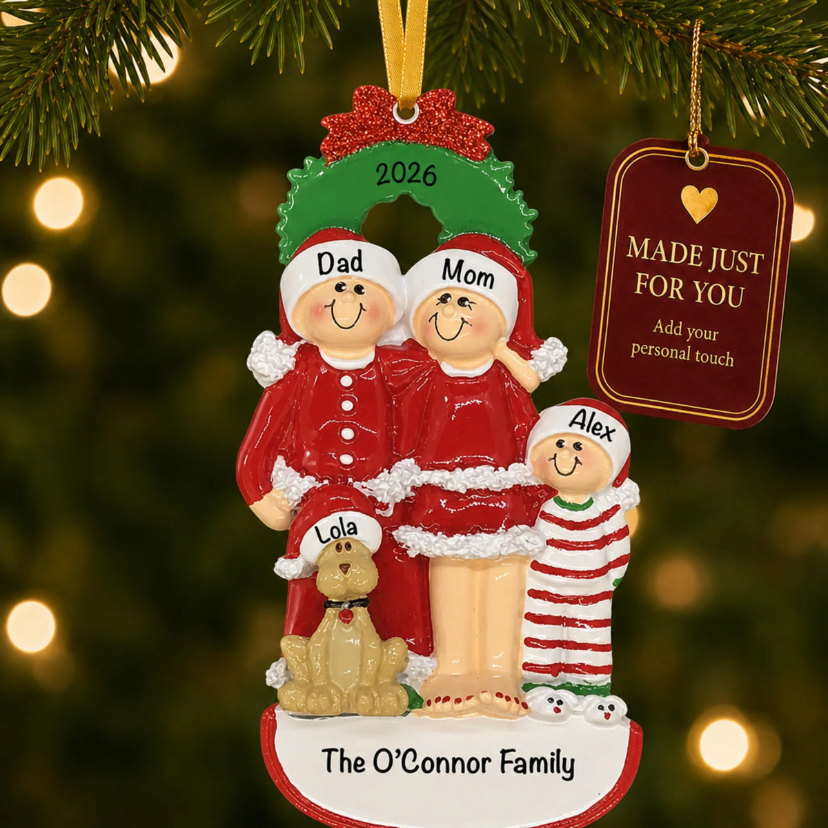 Family of 3 with dog christmas ornament hanging on a lit Christmas tree with a Made Just For You gift tag