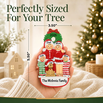 Hand holding family of 4 with dog ornament, 3.5 by 5.5 inches, perfectly sized for your tree
