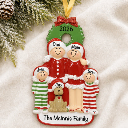 Personalized family of 4 with dog Christmas ornament with names on a soft blanket
