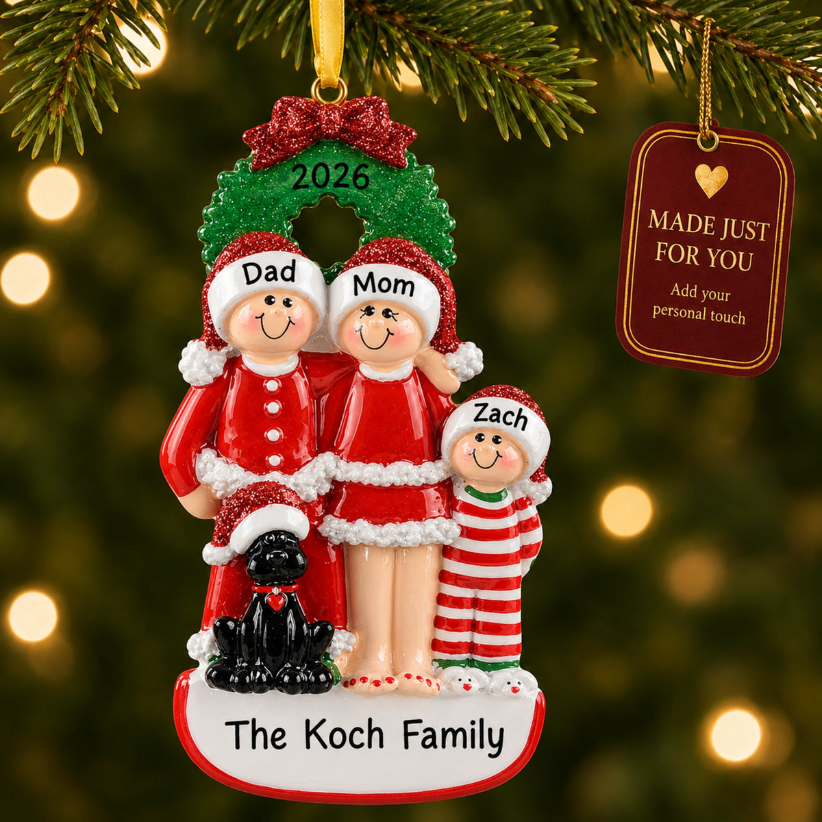 Personalized family of 3 with black dog ornament hanging on a tree with Made Just For You tag