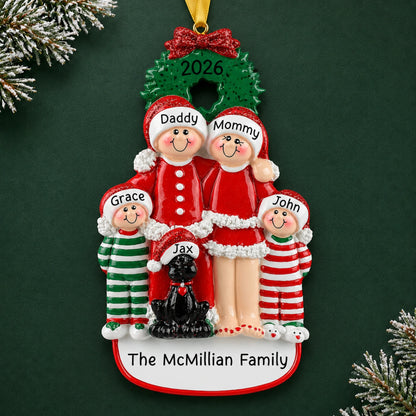 Personalized family of 4 with black dog christmas ornament, four named figures and dog under a wreath