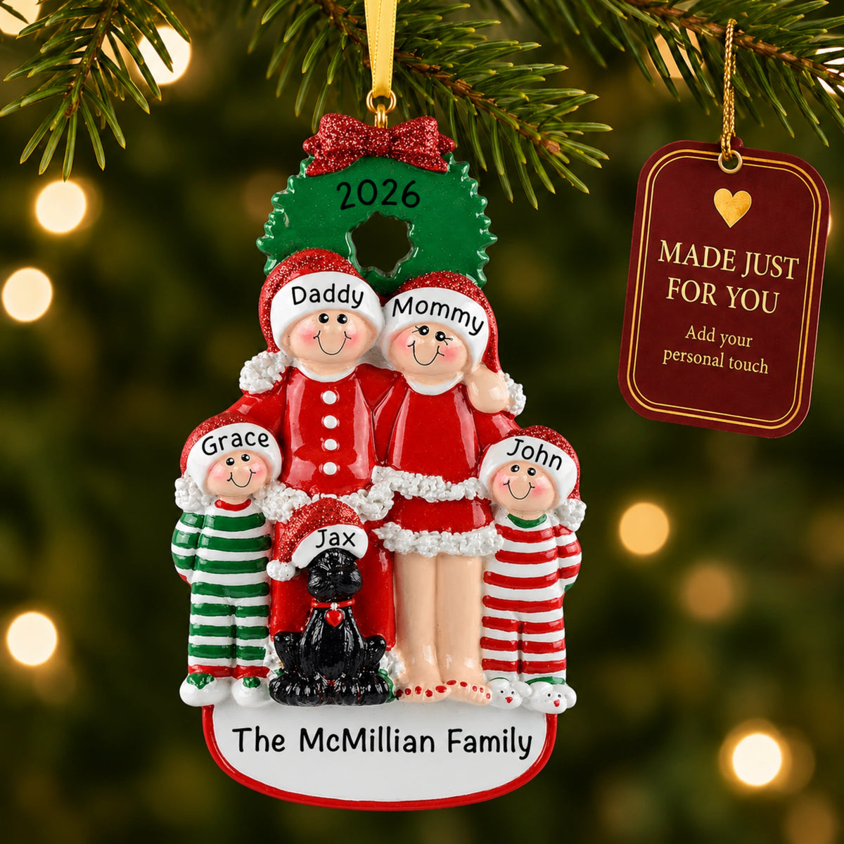 Personalized family of 4 with black dog christmas ornament on a tree with a Made Just For You gift tag