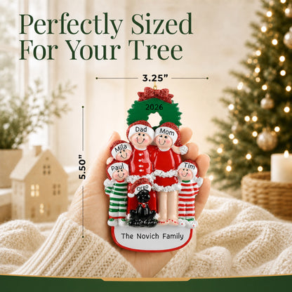 Perfectly sized at 3.25 by 5.50 inches, family of 5 with black dog personalized ornament held in hand