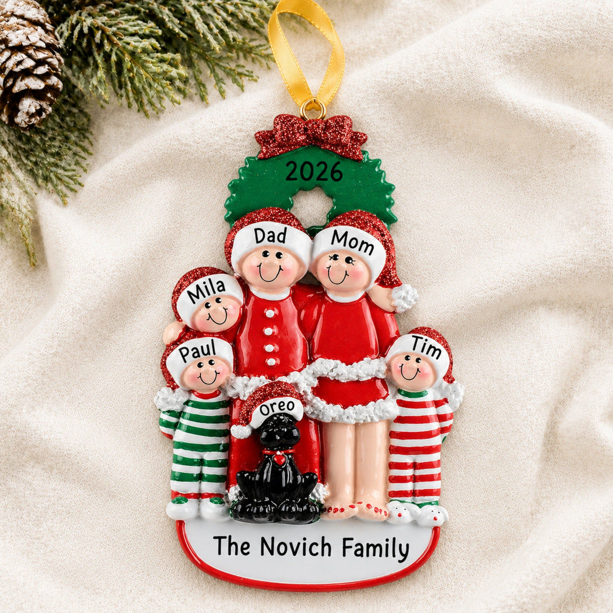 Personalized family of 5 with black dog christmas ornament with names on a snowy white background