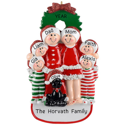 A personalized Christmas ornament featuring a family of six with red clothing and a black dog, with each family member's name on the top. The ornament has a green bow and 'The Horvath Family' text at the bottom.