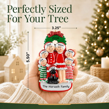 Size guide: the personalized family of 6 with black dog christmas ornament is 3.25 in wide by 5.50 in tall, shown in hand