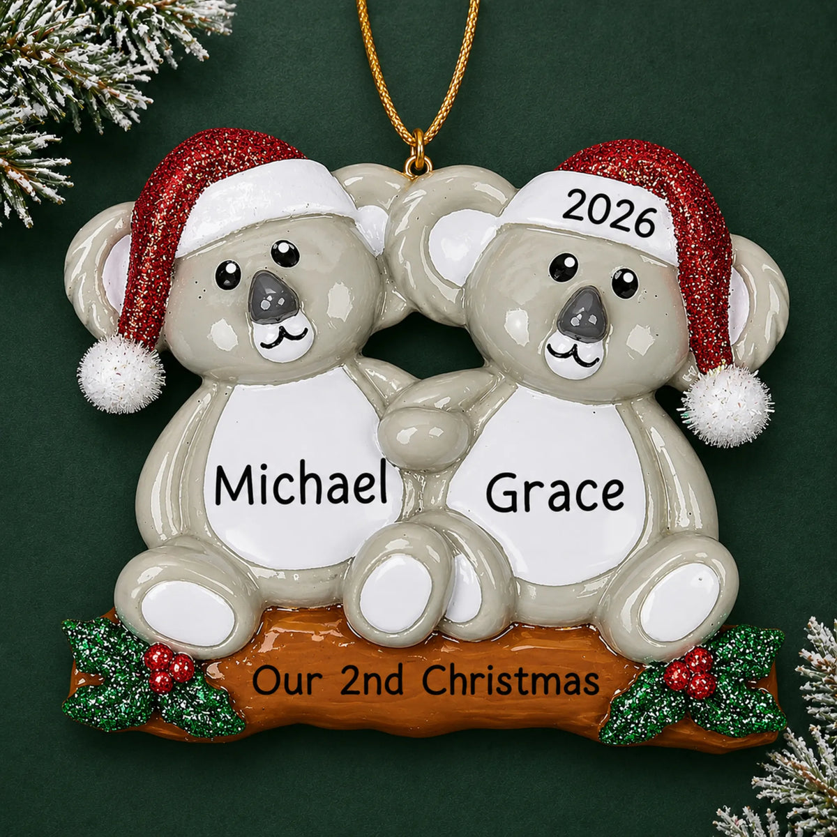 Personalized koala couple christmas ornament on a dark green pine background