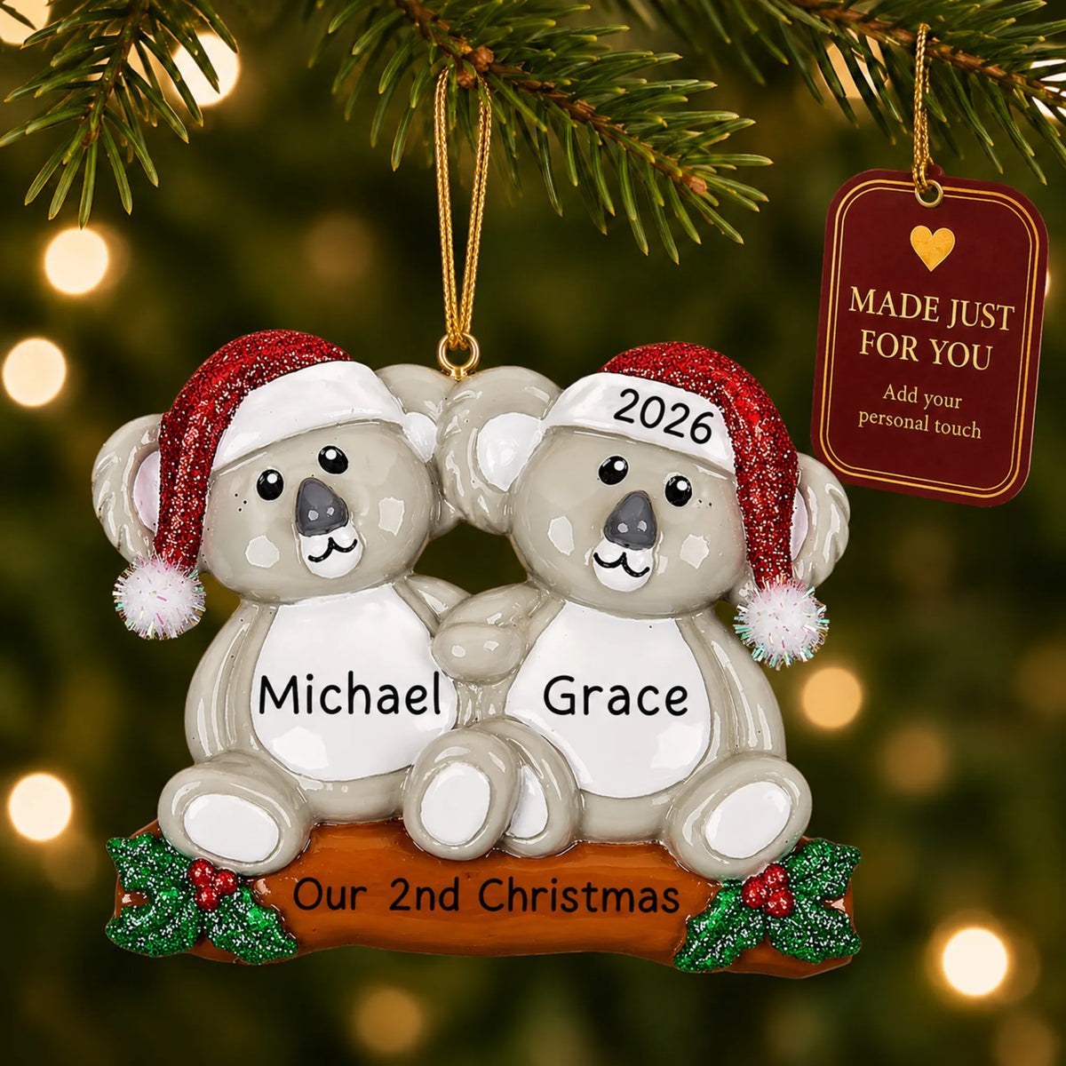 Koala couple christmas ornament hanging on a lit Christmas tree with a Made Just For You gift tag