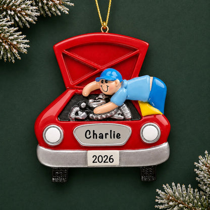 Personalized mechanic christmas ornament on a dark green pine background
