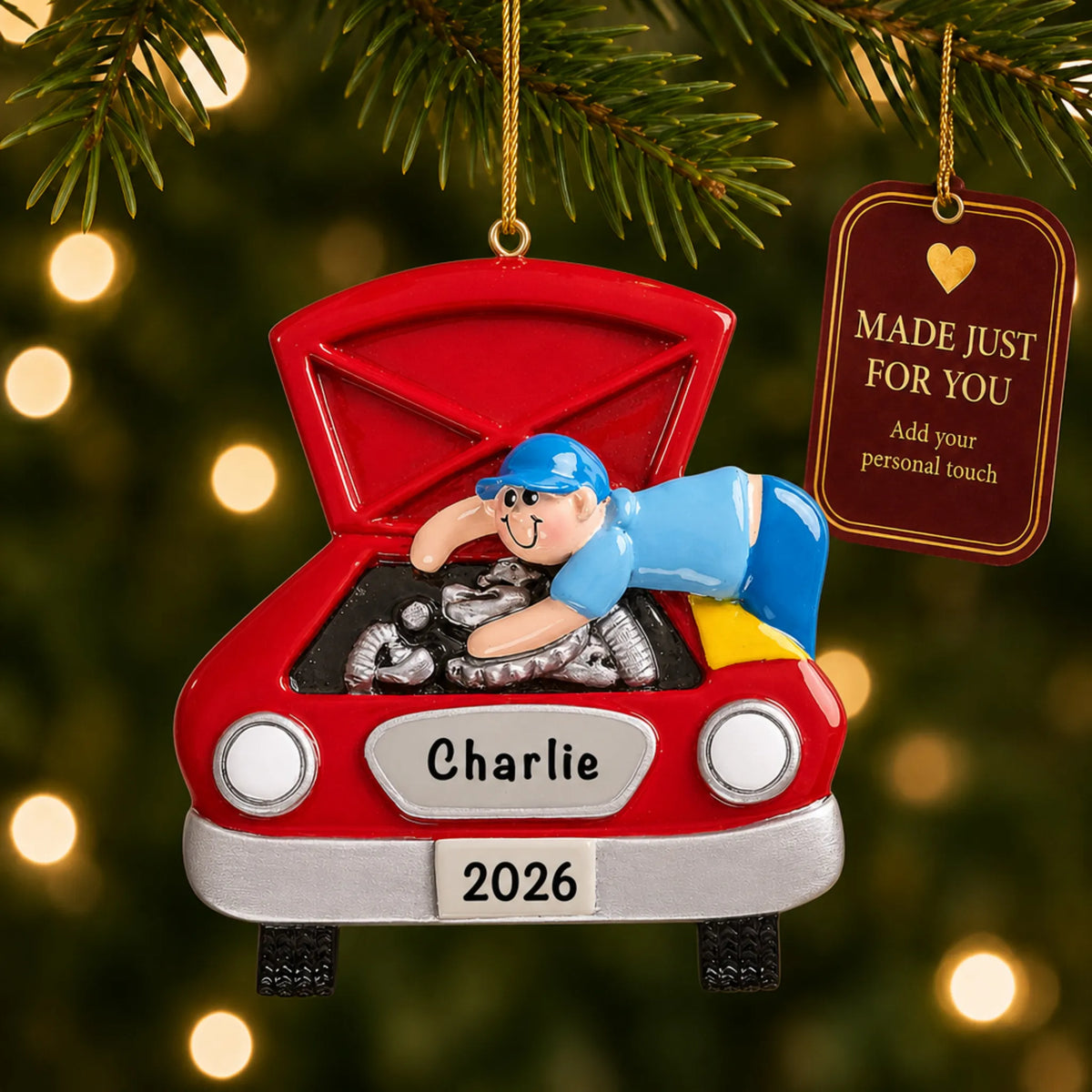 Mechanic christmas ornament hanging on a lit Christmas tree with a Made Just For You gift tag