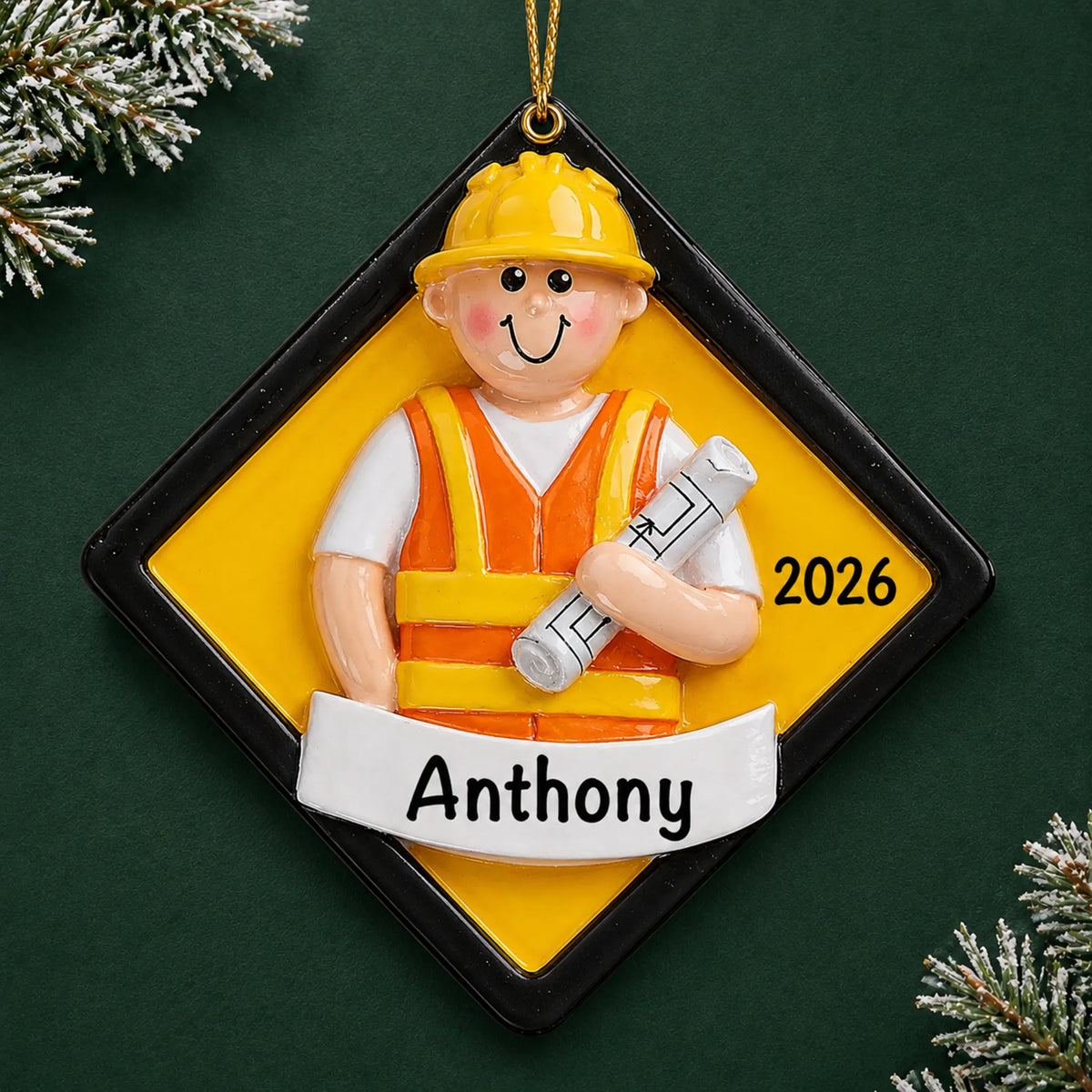 Personalized construction worker christmas ornament on a dark green pine background