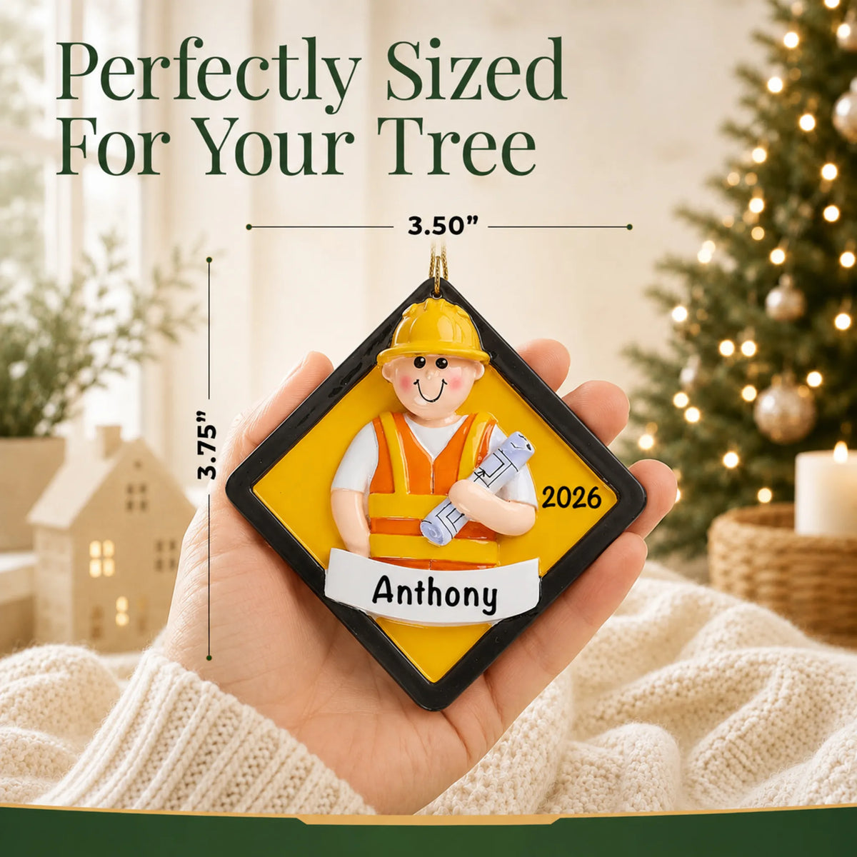Size guide: the personalized construction worker christmas ornament is 3.50 in wide by 3.75 in tall, shown in hand