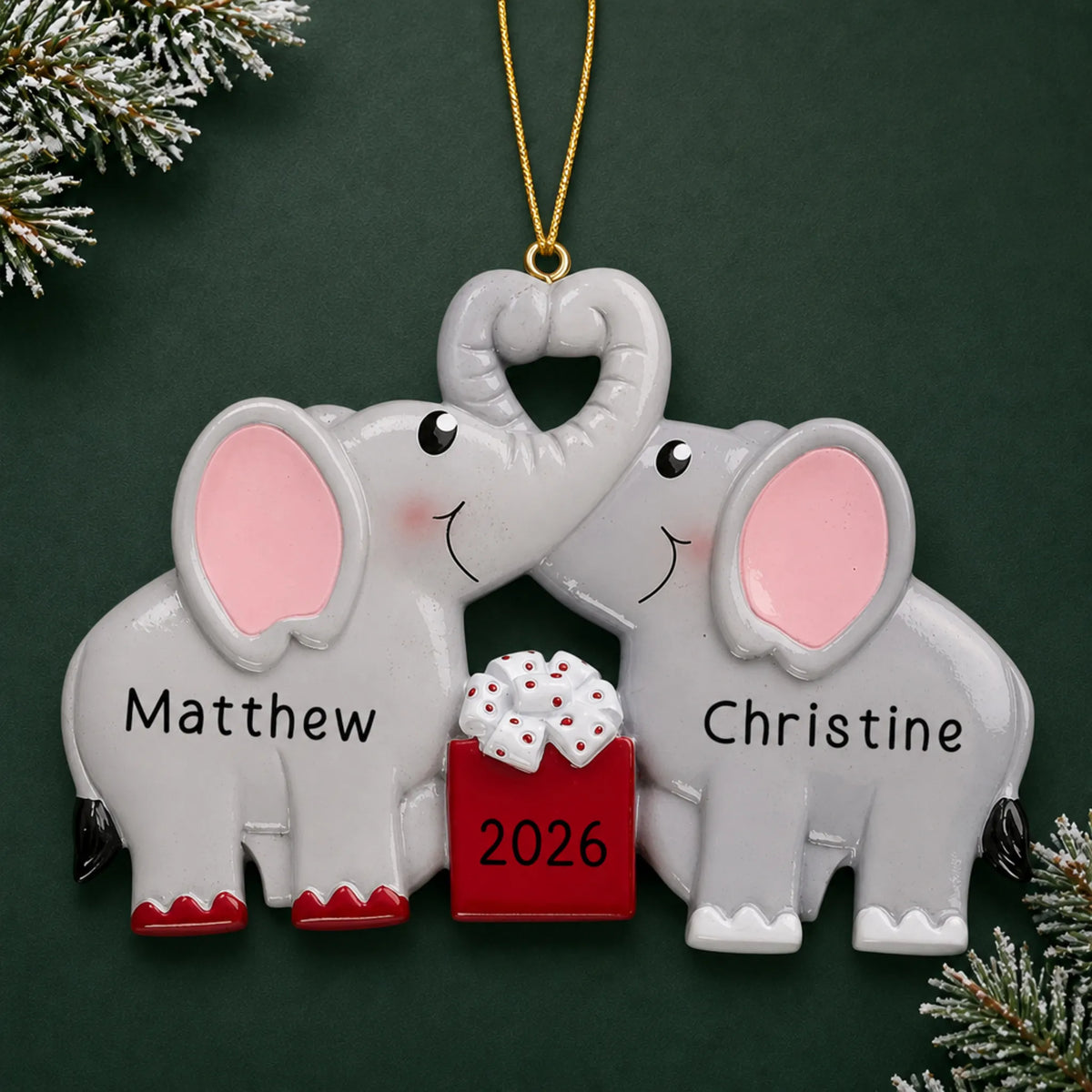 Personalized elephant love couple christmas ornament on a dark green pine background