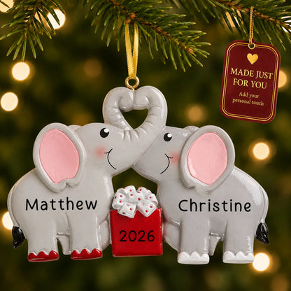 Elephant love couple christmas ornament hanging on a lit Christmas tree with a Made Just For You gift tag