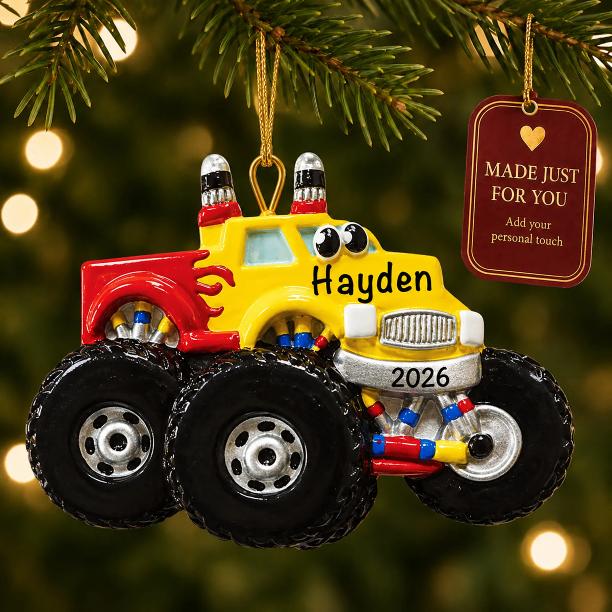 Monster truck kids christmas ornament hanging on a lit Christmas tree with a Made Just For You gift tag