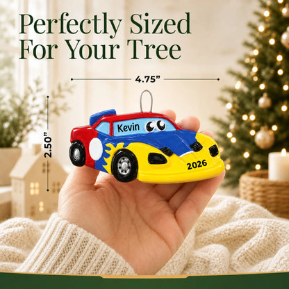 Size guide: the personalized race car christmas ornament shown in hand next to a Christmas tree