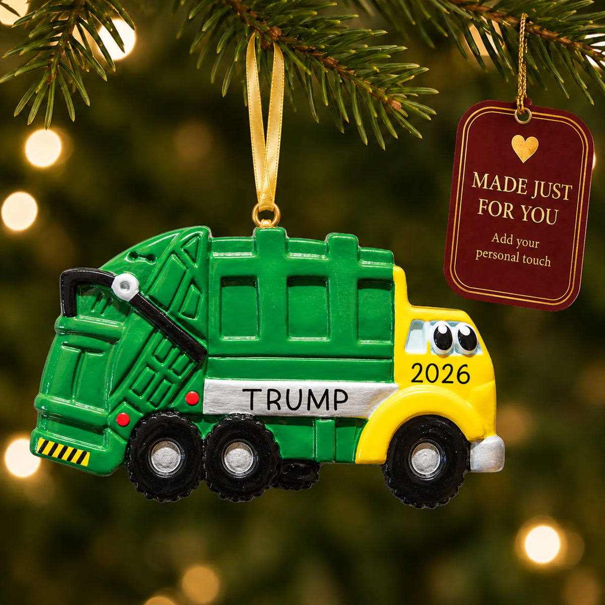 Garbage truck kids christmas ornament hanging on a lit Christmas tree with a Made Just For You gift tag